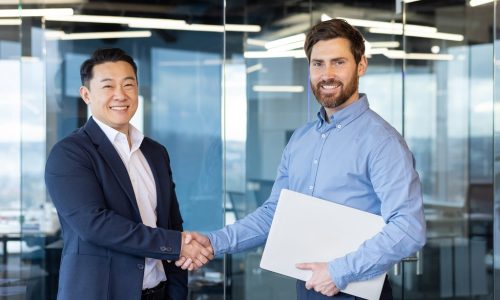 As part of our comprehensive services, Incorp Technical Resources, LLC provides workers' comp policies that protect employers and employees in the event of workplace injuries - Men shaking hands.