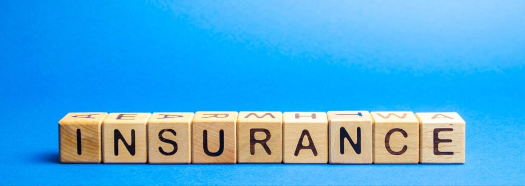 Word “insurance” on wood blocks.